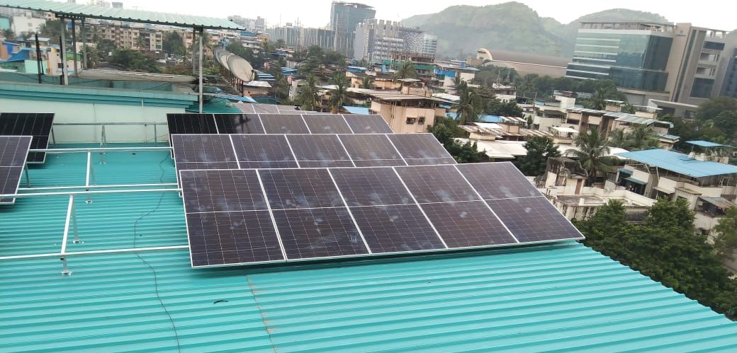 Solar panels on the metal roof of Bhoskar CHSL, Airoli